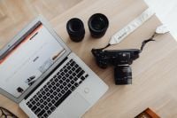 Kaboompics - Top View of Cinema Camera, Lenses and Laptop on Desk