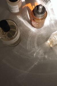 Kaboompics - May Velvet Anti-Pollution Oil and Skincare Bottles in Sunlight