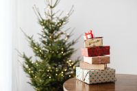 Kaboompics - Christmas Tree and Wrapped Gifts on a Wooden Table