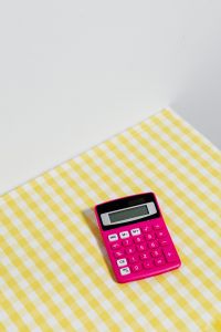 Kaboompics - Vertical Pink Calculator Flat Lay With Copy Space