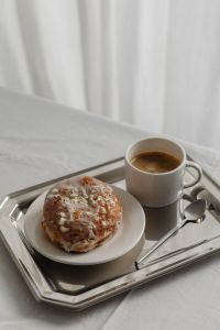 Kaboompics - Glazed Pastry and Coffee Close-Up on Silver Tray