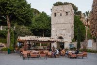 Kaboompics - Stone Tower and Cafe Awning on a Ravello Piazza