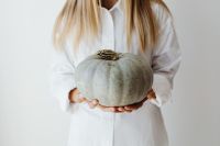 Kaboompics - Woman Holding a White Pumpkin