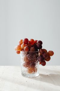 Kaboompics - Red Grapes in a Cut Glass with Generous Copy Space