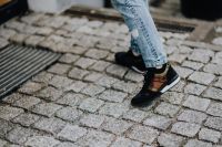Kaboompics - Woman in black sneakers and blue jeans