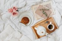Kaboompics - Pink Roses, Cinnamon Roll and Coffee beside a Journal