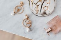 Kaboompics - Overhead Gold Jewelry and Pink Perfume on White Marble with Copy Space