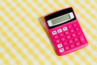 Kaboompics - Close-Up of a Pink Calculator on Yellow Gingham