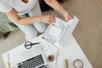 Kaboompics - Careful Tissue-Wrapping for a Boutique Clothing Order in a White Box