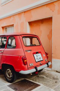Kaboompics - An old red Renault 4 car parked on the street in Izola, Slovenia