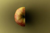 Kaboompics - Apple Half Side View on Olive Green Background
