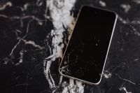 Kaboompics - Broken Mobile on Marble Table