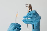 Kaboompics - Close-Up of Dental Forceps and Syringe in Blue Gloves