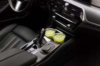 Kaboompics - Two Iced Matcha Drinks in Car Cup Holders