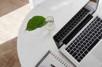 Kaboompics - Overhead Laptop, Pen and Planner on Marble Table with Green Plant, Workspace Mockup