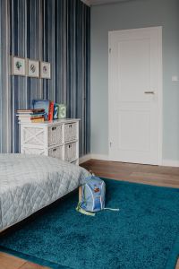 Kaboompics - Child’s room with a few toys, school backpack
