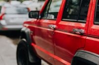 Kaboompics - Rain Drops on Red Jeep Cherokee Door and Rear Fender