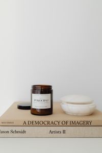 Kaboompics - Open Amber Candle Jar with White Bowl on a Neutral Copy Space Background
