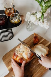 Challah Breakfast Flatlays With Honey, Raspberry Jam, Toast, and Flowers