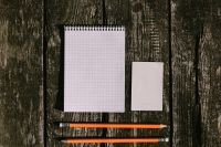 Kaboompics - Grid Notebook and Pencils on Rustic Wooden Planks