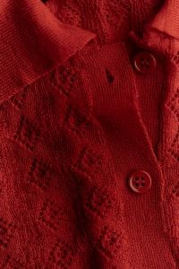 Kaboompics - Vertical Close Up of Red Knitwear and Button