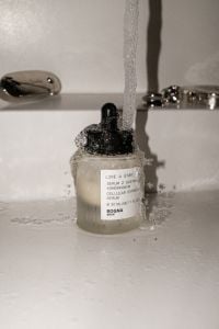 Kaboompics - Flash Photo of Pump Bottle Under Running Sink Water