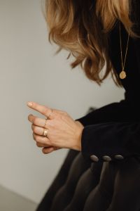 Kaboompics - Side View Woman Showing Gold Rings and Pendant Necklace