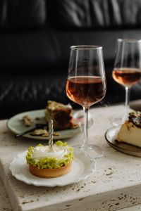 Kaboompics - Celebration Cake with Black Candles and Wine Glass