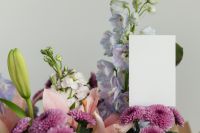 Kaboompics - Vertical Blank Card in Mixed Pastel Flower Bouquet Mockup