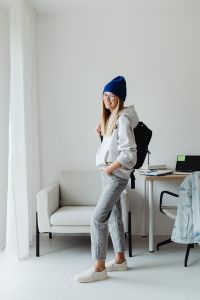 Kaboompics - Teenage Student Wearing Blue Beanie and Black Backpack by Study Desk
