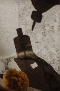 Kaboompics - Skincare Dropper and Bottle Shadows on a Marble Background