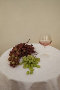Kaboompics - Red and Green Grapes on White Tablecloth