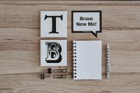 Kaboompics - Inspirational cards with quotes and a notebook
