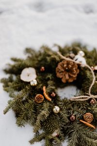 Kaboompics - Close-Up of Evergreen Wreath With Dried Orange and Pine Cones