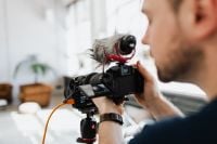 Kaboompics - Filmmaker with DSLR Camera Taking Shoots