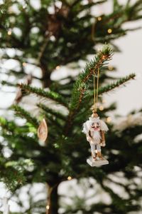Kaboompics - Nutcracker Ornament Hanging on Christmas Tree