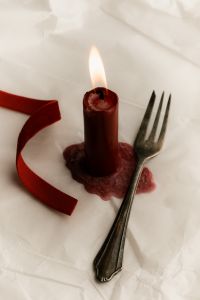 Kaboompics - Burgundy Candle with Vintage Fork and Red Ribbon