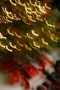 Kaboompics - Abstract Golden Christmas Lights with Red Ribbons and Wrapped Gifts