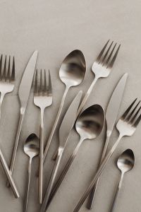 Kaboompics - Assorted Matte Steel Kitchen Cutlery with Copy Space on Gray Background