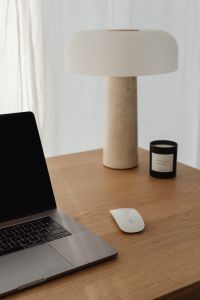 Kaboompics - Close-Up Travertine Table Lamp with Candle and Laptop
