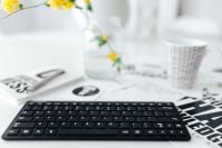 Kaboompics - Female hands typing on the remote wireless computer keyboard
