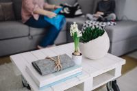 Kaboompics - Small wooden table with a potted plant and a grey wallet