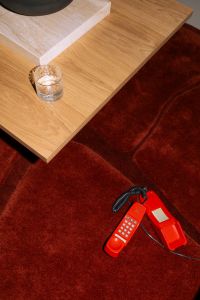 Kaboompics - Overhead Living Room Scene With Coffee Table And Red Phone