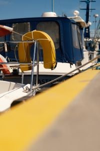 Kaboompics - Yellow Lifebuoy on Boat in Marina