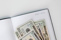 Kaboompics - U.S. Dollars on an Open 2021 Diary Calendar