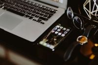 Kaboompics - Overhead Black Desk with Laptop, Phone, Glasses and Watch