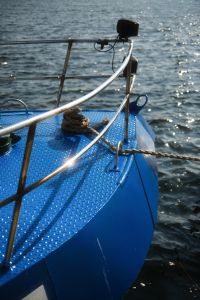 Kaboompics - Blue Fishing Boat Bow on Sunlit Water