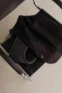 Kaboompics - Black Blazer and Handbag on Chrome Chair Flat Lay