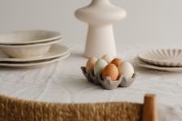 Kaboompics - Pastel Eggs And White Vase On Minimal Easter Table