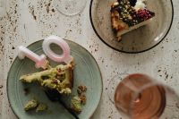 Kaboompics - Overhead Cake Slices, Number Candle and Rosé Wine